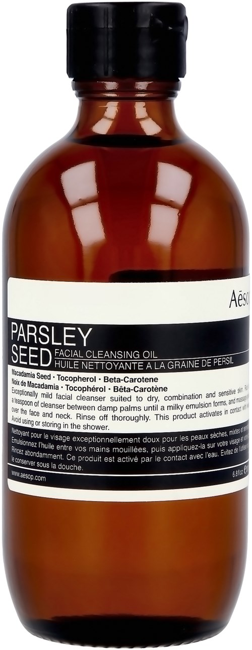 Kleine braune Flasche mit weißem Etikett 'Parsley Seed Facial Cleansing Oil' und schwarzem Deckel.