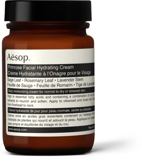 Ein brauner Behälter mit weißem Etikett und schwarzem Deckel, gekennzeichnet Aesop Primrose Facial Hydrating Cream.