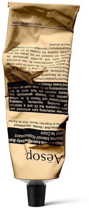 Eine Tube in Gold-, Schwarz- und Beigetönen mit Haarstyling-Creme von Aesop.