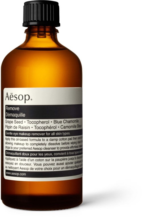 Kleine bernsteinfarbene Flasche mit schwarzem Deckel, Beschriftung für Make-up Entferner mit natürlichen Inhaltsstoffen wie Kamille und Traubensamen.