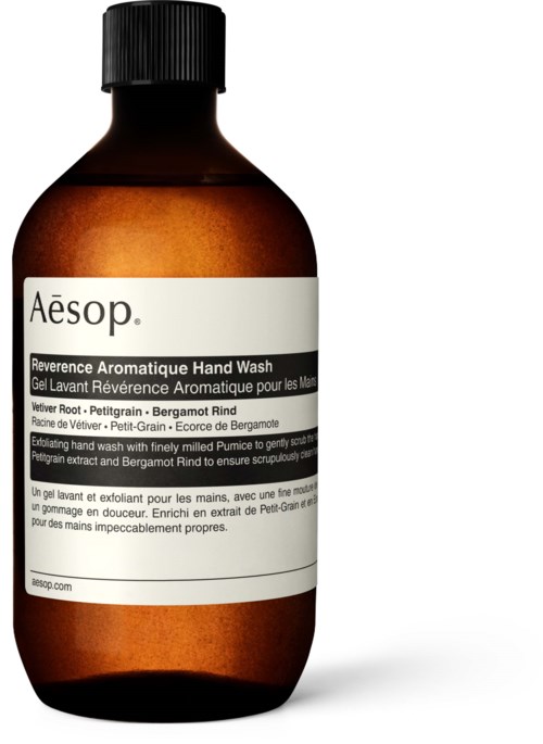 Eine braune Flasche mit schwarzem Deckel, weißem Etikett und schwarzem Text über Handwaschmittel mit Bergamotte-Duft.