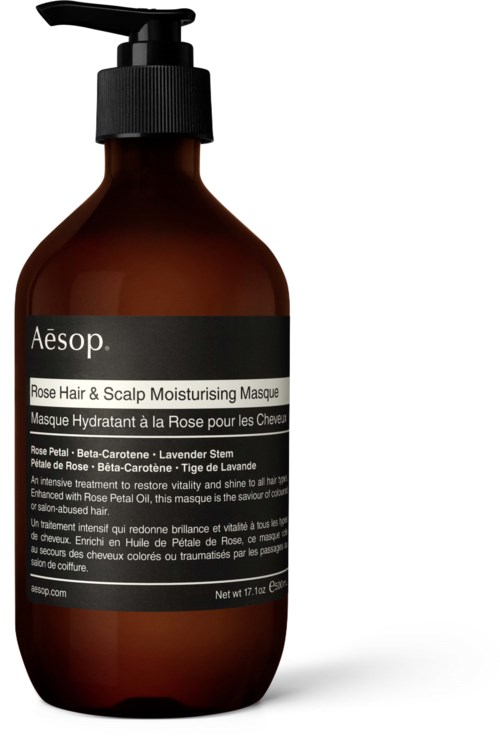 A brown bottle with a pump labeled Aesop Rose Hair & Scalp Moisturising Masque. Contains cream for hair care.