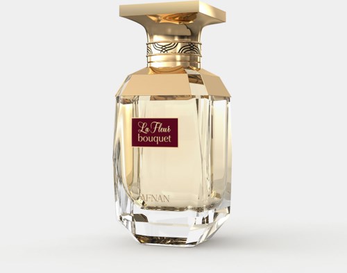 Een parfumfles met een gouden en beige dop, doorzichtig glazen lichaam en een rood label met "La Fleur bouquet."