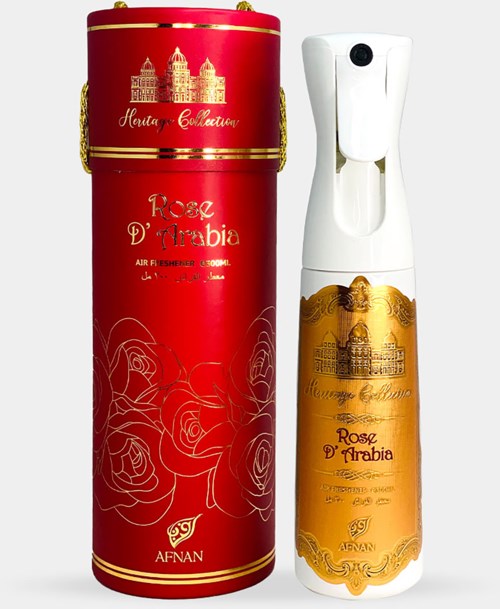 Punainen spray-tölkki ja valkoinen suihkepullo kultaisilla yksityiskohdilla, molemmat merkity 'Rose d'Arabia.'
