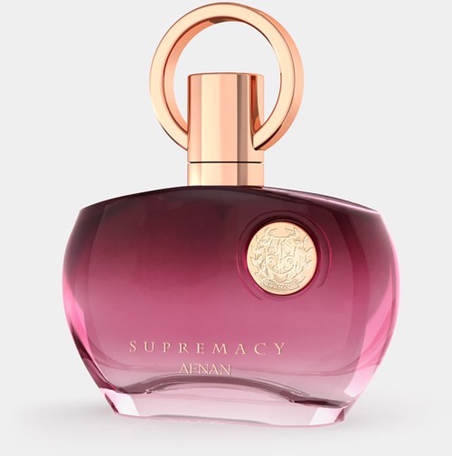 A pink and purple perfume bottle with a gold ring and a gold circular emblem, labeled 'SUPREMACY'.