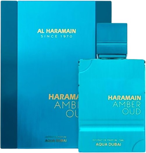 Kuvassa on sininen laatikko ja pienempi sininen pakkaus Al Haramain Amber Oud -hajuvedelle.