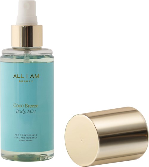 Een blauwe body mist fles met goudkleurige dop en spray, gemerkt 'Coco Breeze Body Mist'.