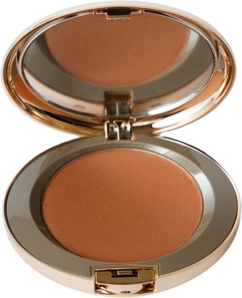 A round makeup compact with a mirror inside, containing peach-colored powder for face use.