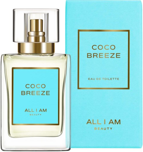Eine Parfü Bottle und Schachtel mit hellblauen Etiketten und goldener Schrift, mit Coco Breeze von All I Am Beauty.