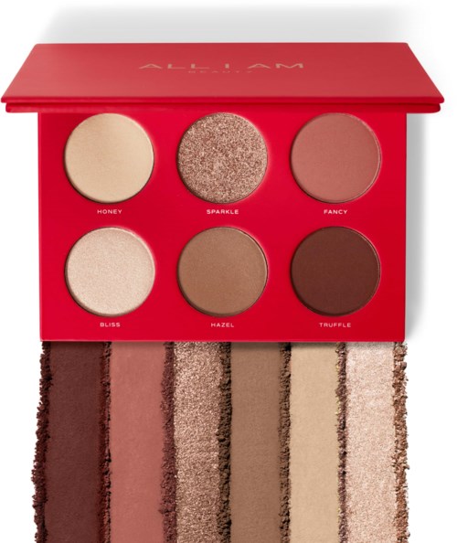A red makeup palette with six round shades and a matching brush, blending neutral and warm colors.