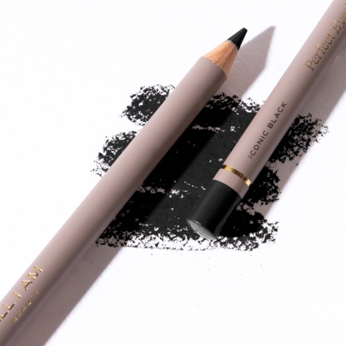 A beige pencil and a white pen with black ink mark on white paper.