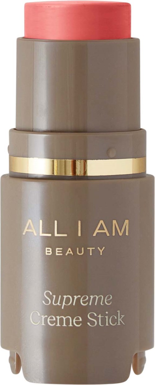 A beige and pink stick product labeled 'Supreme Creme Stick' from All I Am Beauty.