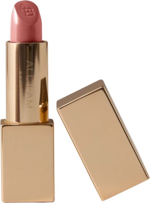A pink lipstick with a gold case and a detached lid.