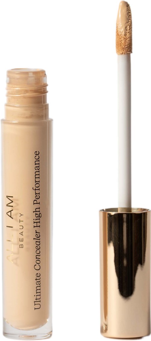 Een beige concealer tube met goudkleurige dop en applicator. Op het label staat "L.A. Girl Ultimate Concealer."