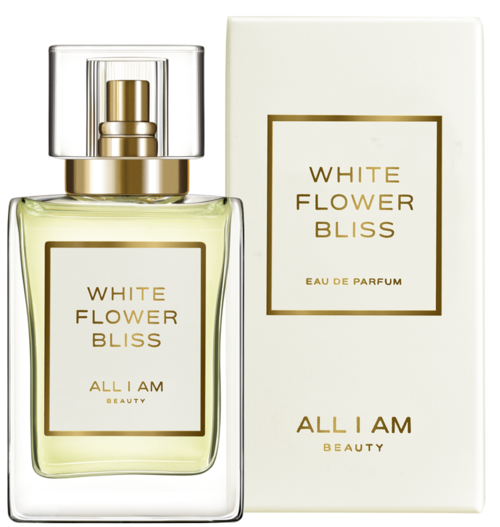 Een parfumfles met label 'White Flower Bliss' en een bijpassend wit doosje, beide van All I Am Beauty.