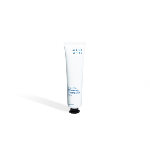 Biała tubka pasty do zębów z niebieskim tekstem, oznaczona 'Alpine White' i 'Extra White Whitening Toothpaste.'