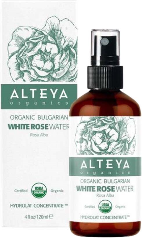 Ruskea sumutepullo, jossa lukee 'Alteya Organics' ja on valkoinen ruusukuvitus, vieressä sen pakkaus.