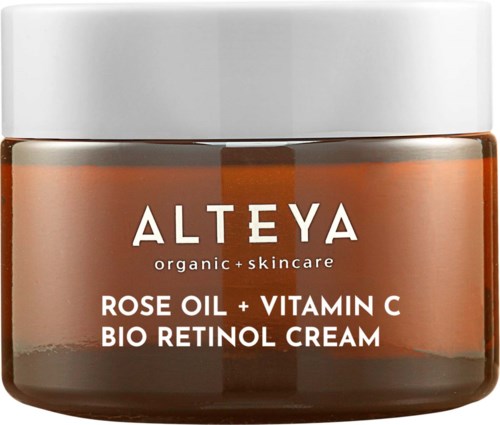 Alteya-kuorintapurkin, jossa on ruusunöljyä, C-vitamiinia ja bio-retinolia. Valkoinen kansi, ruskea lasipurkki.