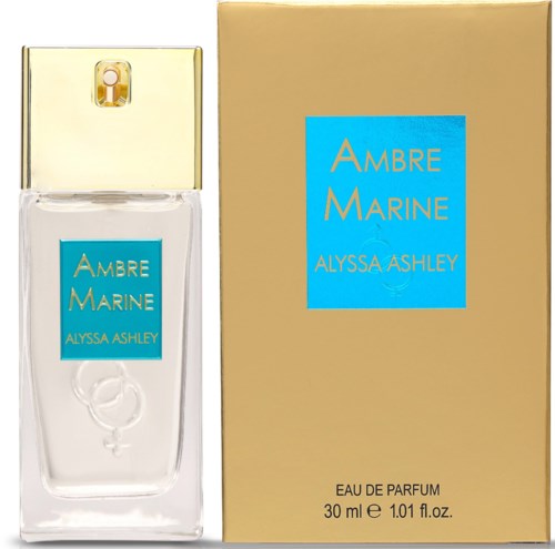 Ein Parfümflasche mit klarem Glas, goldener Kappe und blauer Etikette; daneben eine passende beige Box mit blauer und goldener Schrift.