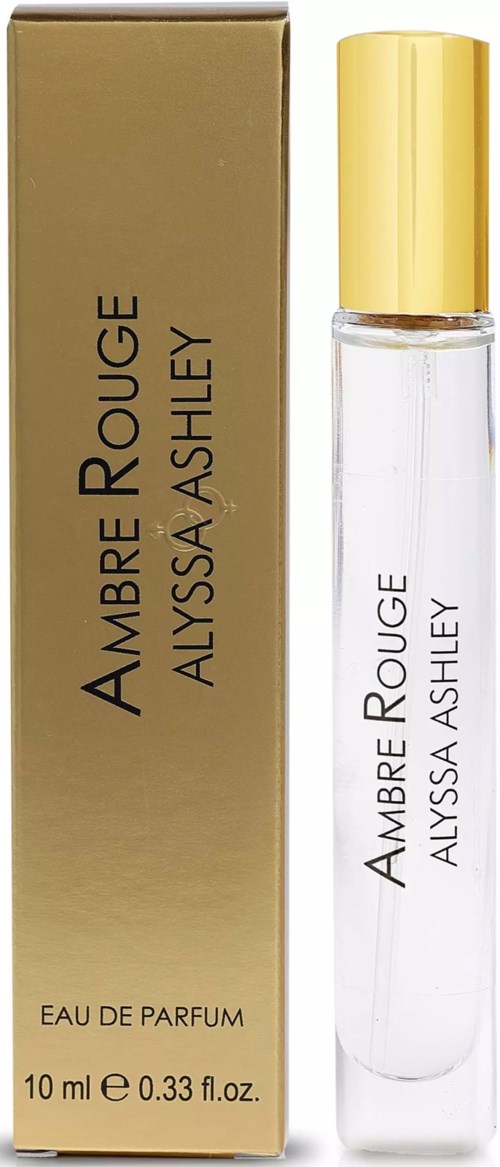 Ein Parfümflasche und Box mit 'Amber Rouge' von Alyssa Ashley, mit goldener Kappe und klarer Flasche.
