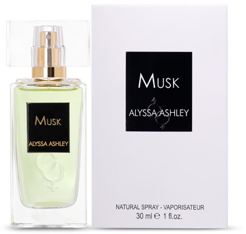 Ein Parfümflasche mit grüner Flüssigkeit und goldener Verschluss neben einer weißen Box mit schwarzem Etikett, das Musk sagt.