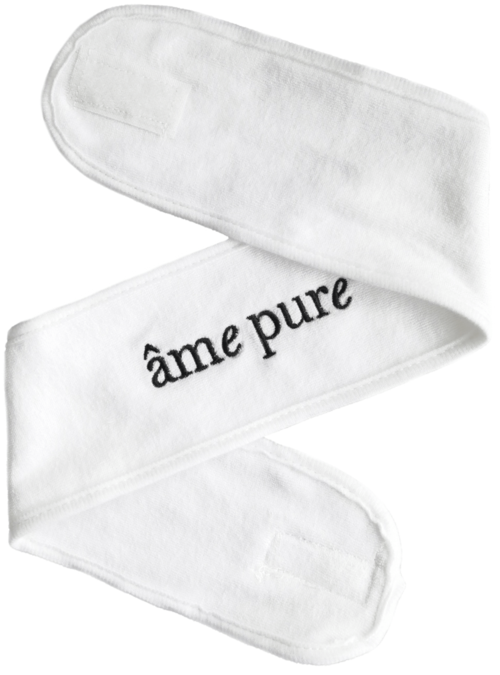 Ein weißes Stoffband mit den Worten "âme pure" bestickt. Es ist in einer Zickzack-Form gefaltet.