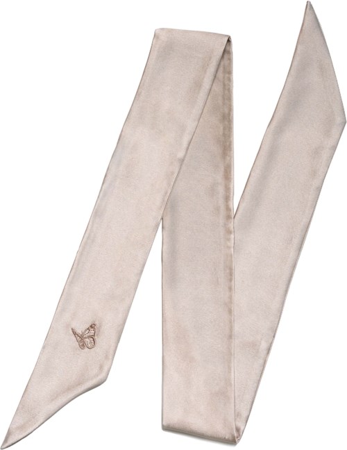 A shiny beige satin sash with a small bow detail at one end, long and narrow.