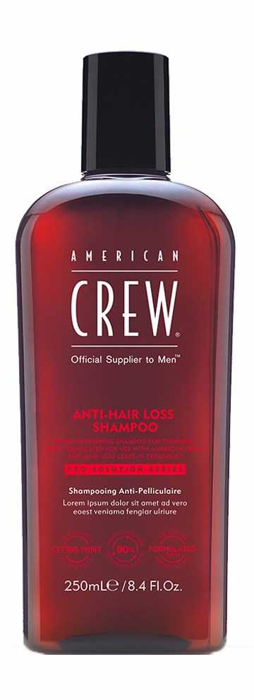 Red bottle of American Crew Anti-Hair Loss Shampoo with black cap. Text on bottle includes brand name and product details.