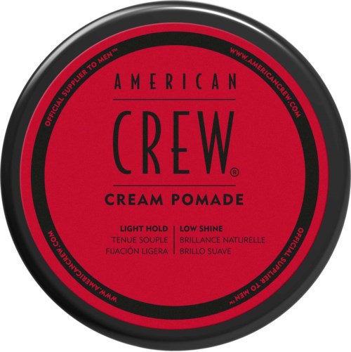 A round red and black container with 'American Crew' cream pomade label for hair styling.