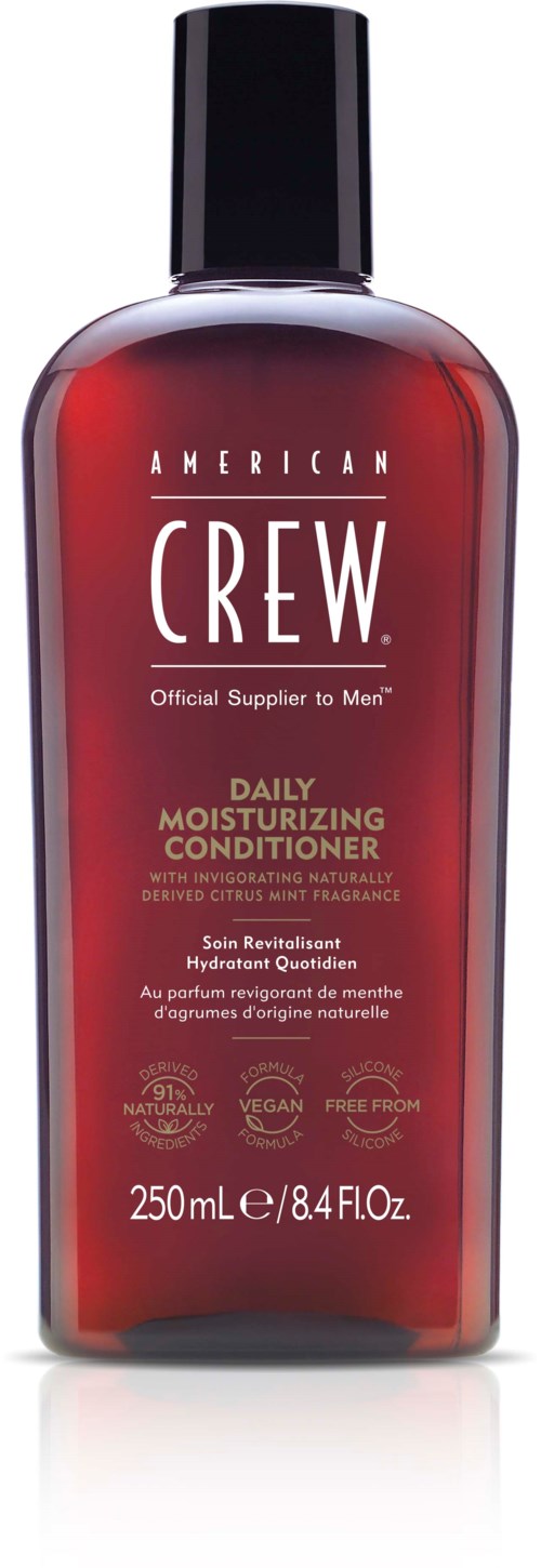 Eine rote Flasche mit schwarzem Deckel, beschriftet American Crew Daily Moisturizing Conditioner, für Männerhaarpflege.