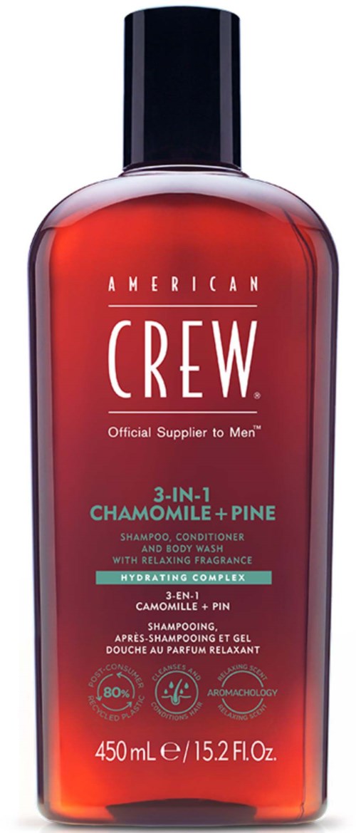 A red bottle of American Crew 3-in-1 shampoo, conditioner, and body wash with black cap and white text.