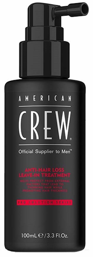Een zwarte fles met pomp, gemarkeerd American Crew Anti-Hair Loss Leave-In Treatment, voor haarverzorging.