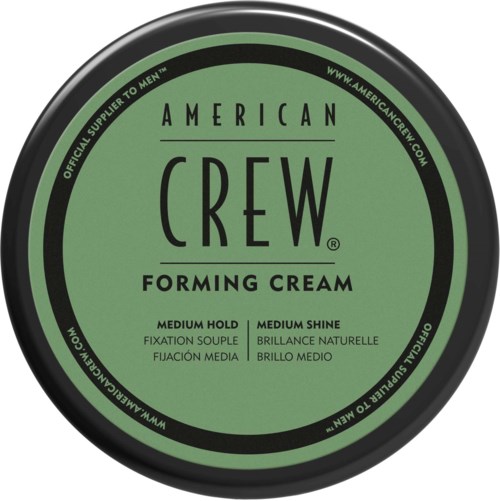 A round, green container lid labeled 'American Crew Forming Cream' with instructions for medium hold and shine.