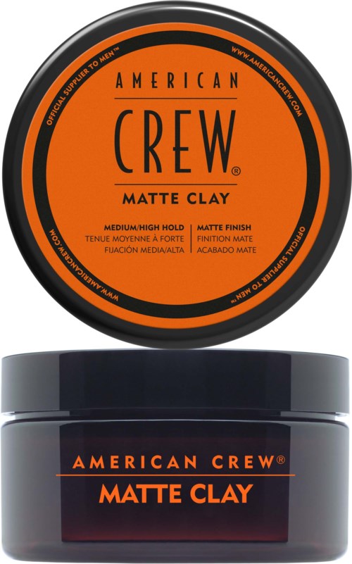A round black container with orange label and a smaller jar with matching black and orange label.