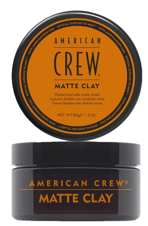 A round metal container with a black and orange label for American Crew Matte Clay hair styling product.
