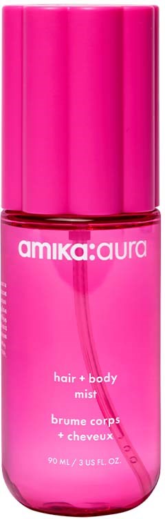 Pink bottle of hair and body mist with white text and a pink cap.