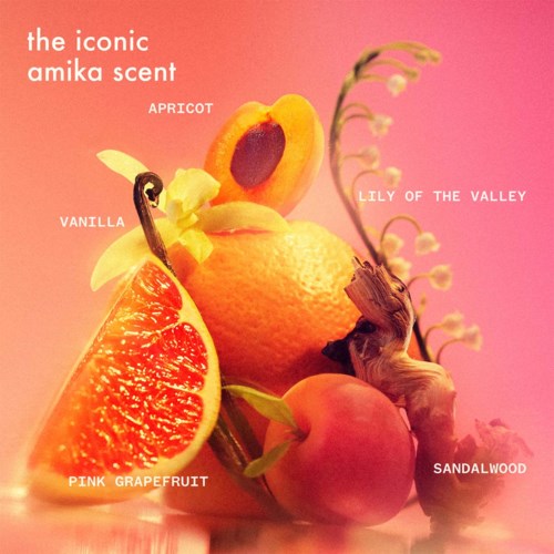 A collection of fruit with labels and a decorative flower, displaying various shades of orange, pink, and yellow.