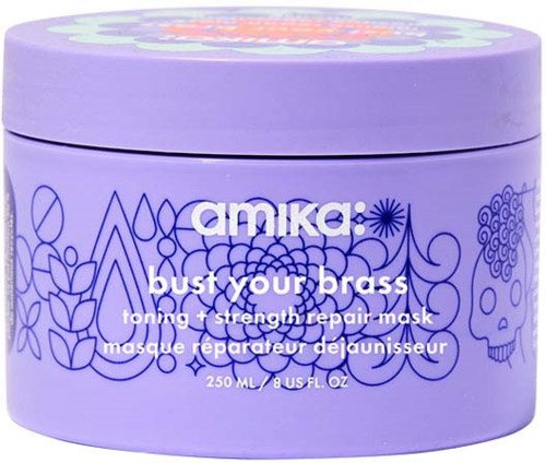 Violetissa kannussa on sinisiä koristeellisia kukka- ja kallo-aiheita, merkitty 'amika: bust your brass', hiusnaamio sävyyn ja vahvistukseen.