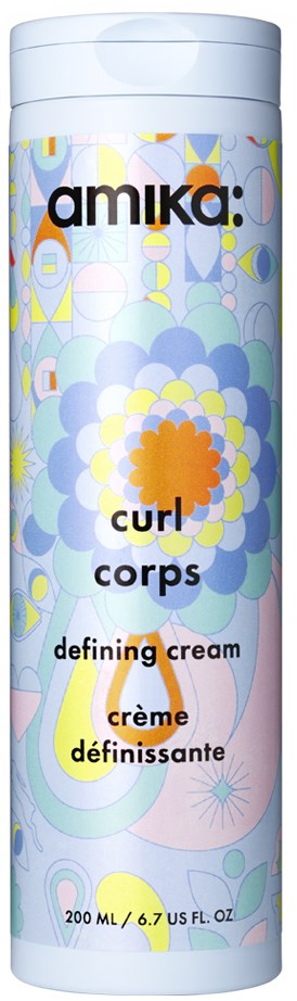 A cylindrical container with colorful floral and abstract patterns, labeled as curly hair defining cream by Amika.
