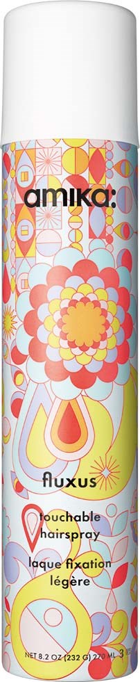 Colorful cylindrical can with floral and abstract patterns, labeled 'amika' and 'fluxus' for touchable hairspray.