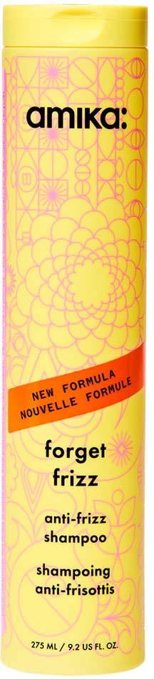 Keltainen pullo, jossa on pinkkejä kuvioita ja punainen nauha, merkitty 'Forget Frizz' anti-frizz shampoo Amikalta.