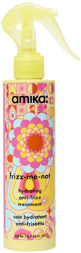 Gelbe Sprühflasche mit buntem Blumenmuster und Text für hydratisierende Anti-Frizz-Behandlung.