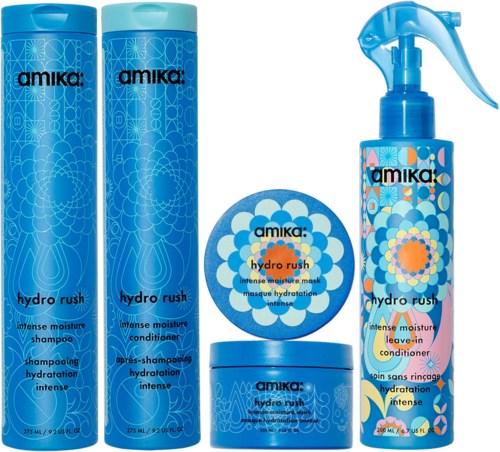 Collection of hair products including shampoos, conditioner, a mask, and a spray, all in blue packaging with floral designs.