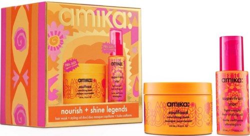 Et sett med Amika hårpleieprodukter i orange og rosa emballasje med en fargerik eske.