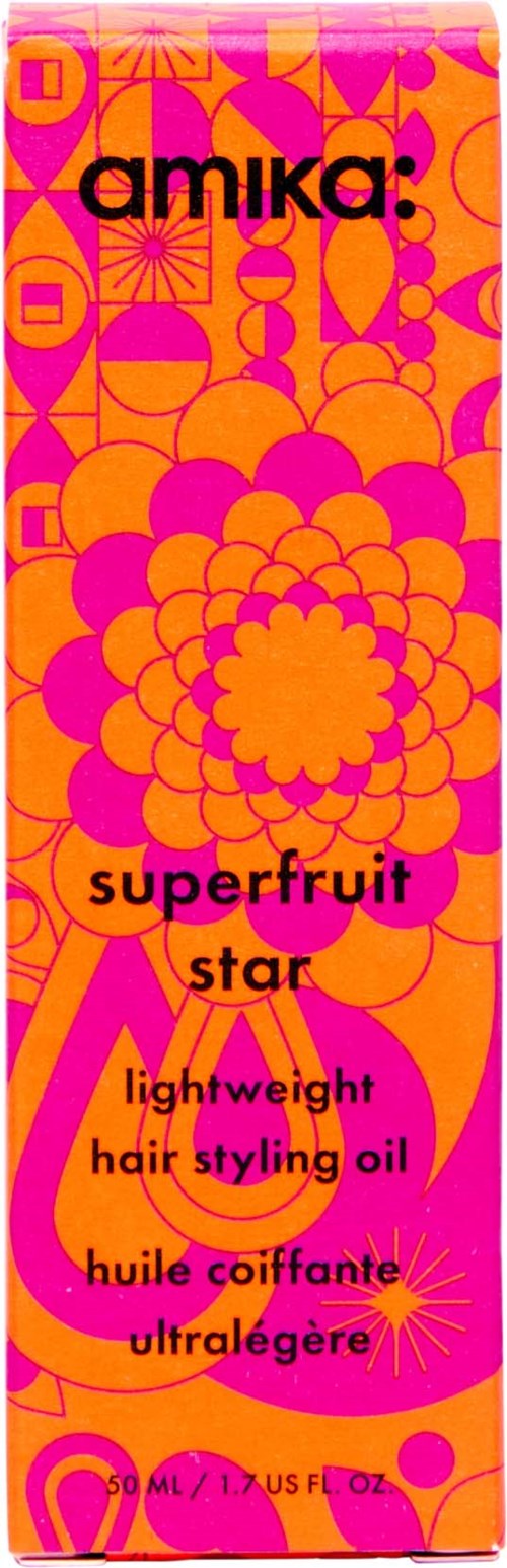 Bright pink and orange packaging with the brand name 'amika' and product details for a lightweight hair oil.