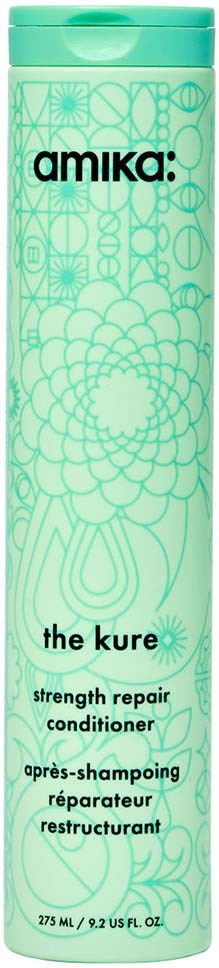 A tall, green bottle of Amika hair conditioner called "the kure" with decorative geometric patterns.