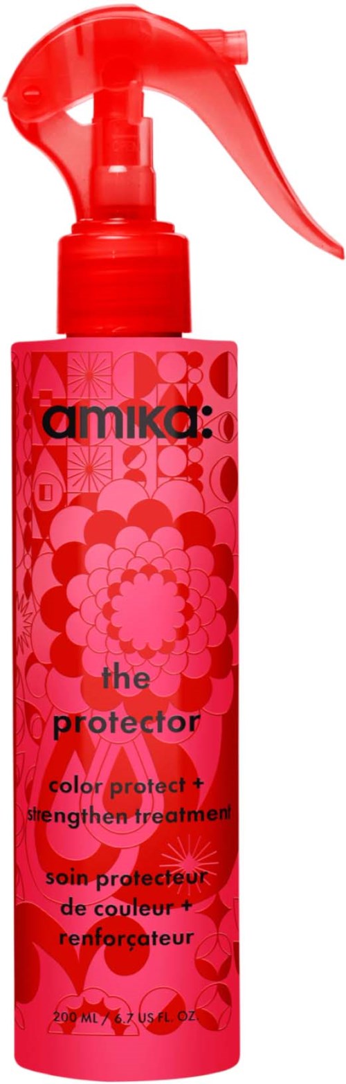Rosa sprayflaska med blomsterdesign, märkt amika the protector, för färgbeskydd och stärkande.
