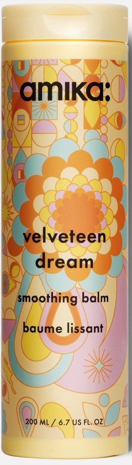 A tall, colorful bottle with a floral design, labeled "Velveteen Dream," used for soothing balm, 200 ml.