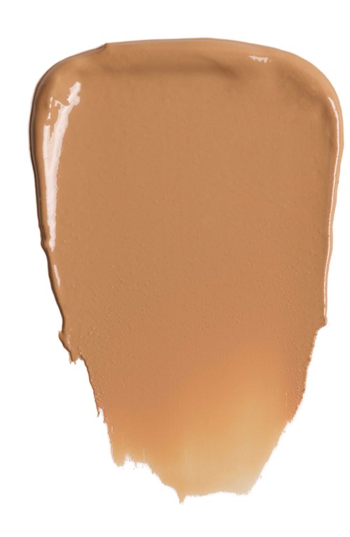Ein beige-braune Flüssigkeit auf weißem Hintergrund, glatt und glänzend, mit unregelmäßigen Kanten am unteren Rand.