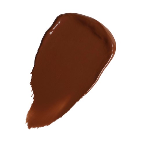 Ein Klumpen brauner Schminke oder Farbe mit glänzender Oberfläche und spitzer Endung.